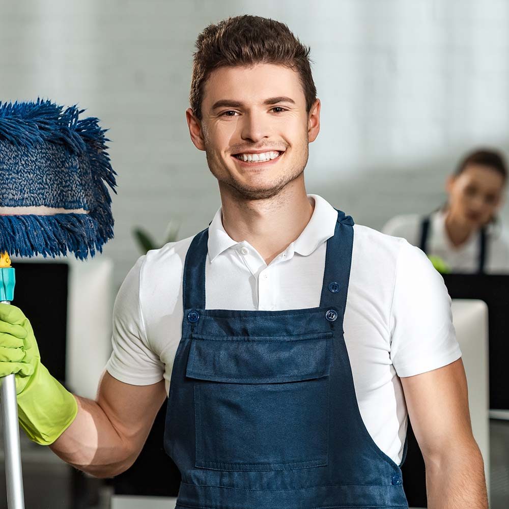 cheerful-cleaner-holding-mop-while-looking-at-came3-NANDH2L.jpg cheerful-cleaner-holding-mop-while-looking-at-came3-NANDH2L.jpg